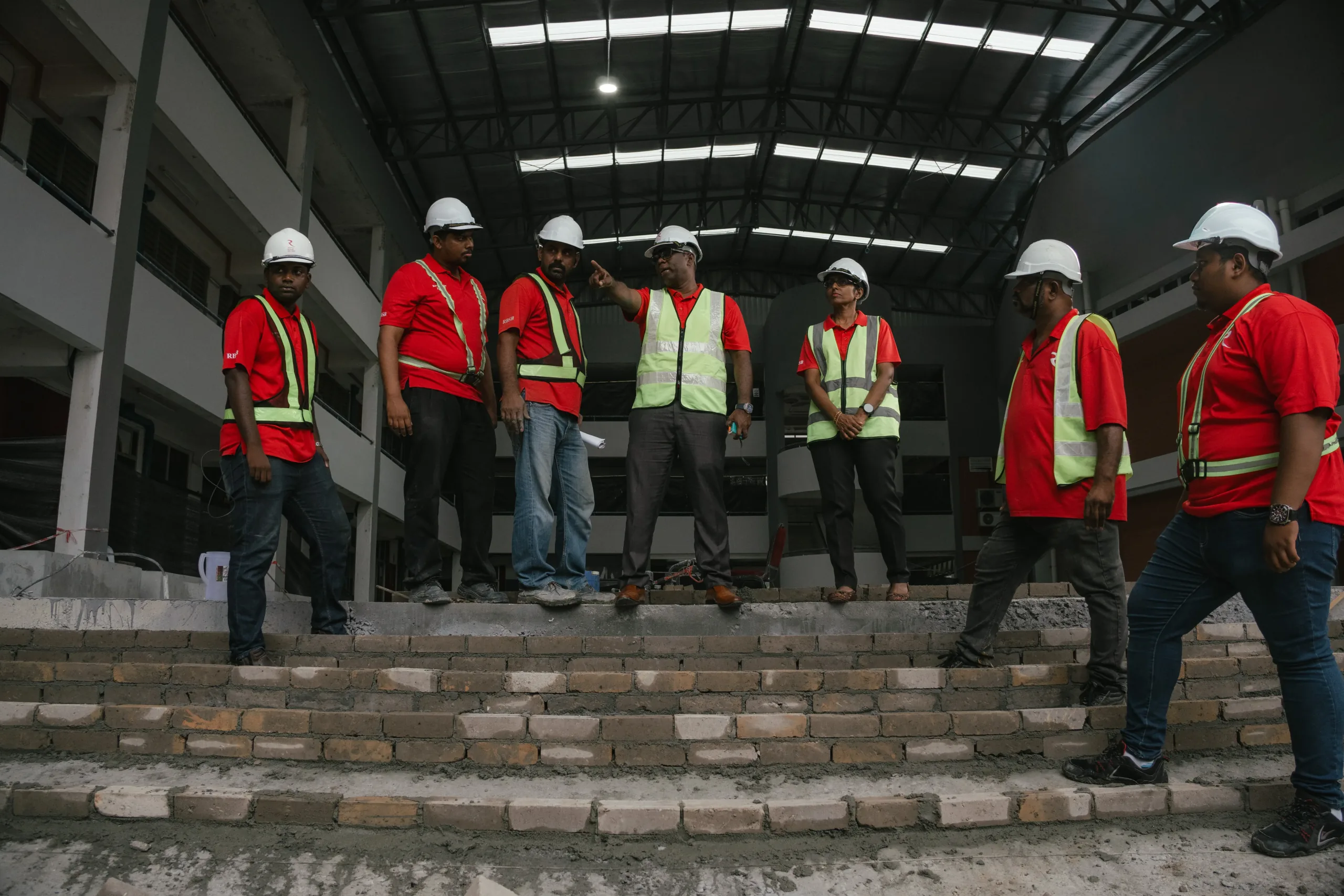 Ravvel Builder Sdn Bhd team reviewing construction progress